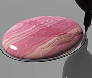 Cabochon being traced on silver sheet